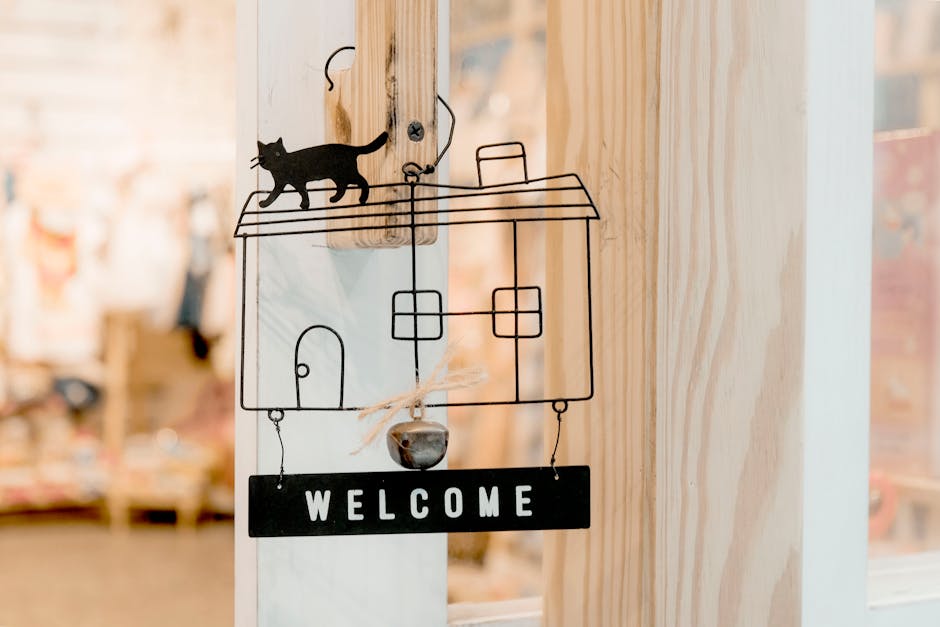 Interior design wooden door decoration featuring a welcome sign with cat silhouette.