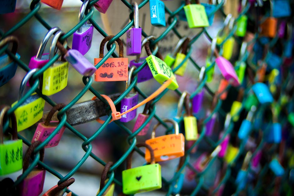 Vibrant love padlocks attached to a fence in Kowloon, Hong Kong, symbolizing love and connection.