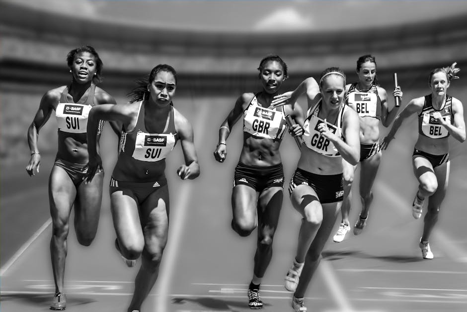 Female athletes in a high-stakes track race showcasing physical prowess and competition.